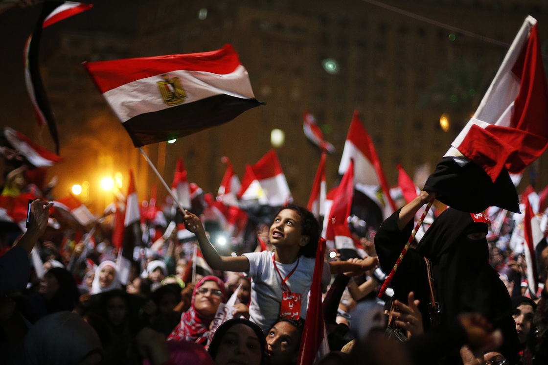 Protesters react after President Mohammed Morsi was ousted by the military on Wednesday in Tahrir Square in Cairo. The head of Egypt's armed forces General Abdel Fattah El Sissi issued a declaration suspending the constitution and appointing Egypt's chief justice as interim head of state.